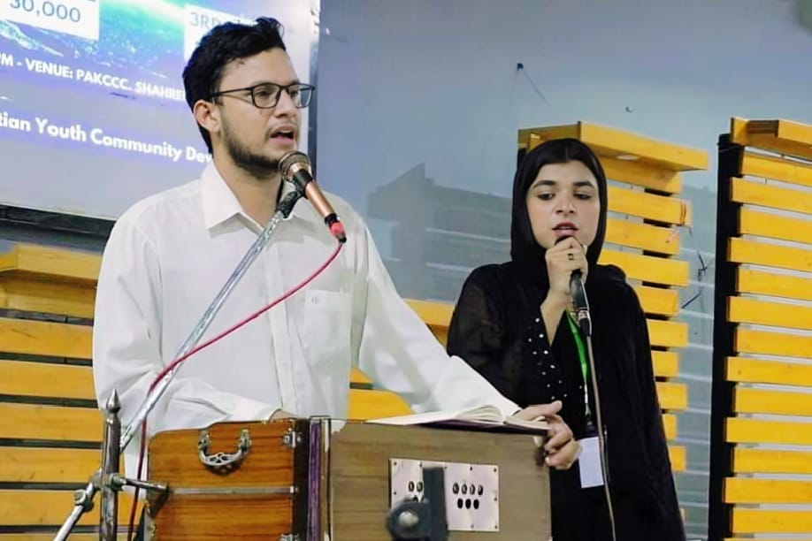 CYCD members singing and praising during a worship event